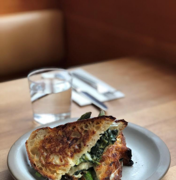 How to Build the Perfect Grilled Cheese (And Pick the Perfect Bourbon to Wash it Down) Tartine Manufactory Grilled Cheese Sandwich with Cowgirl Creamery Wagon Wheel, Mornay, Asparagus, Mint, Fava Greens & Spring Onions on Tartine Country Bread.